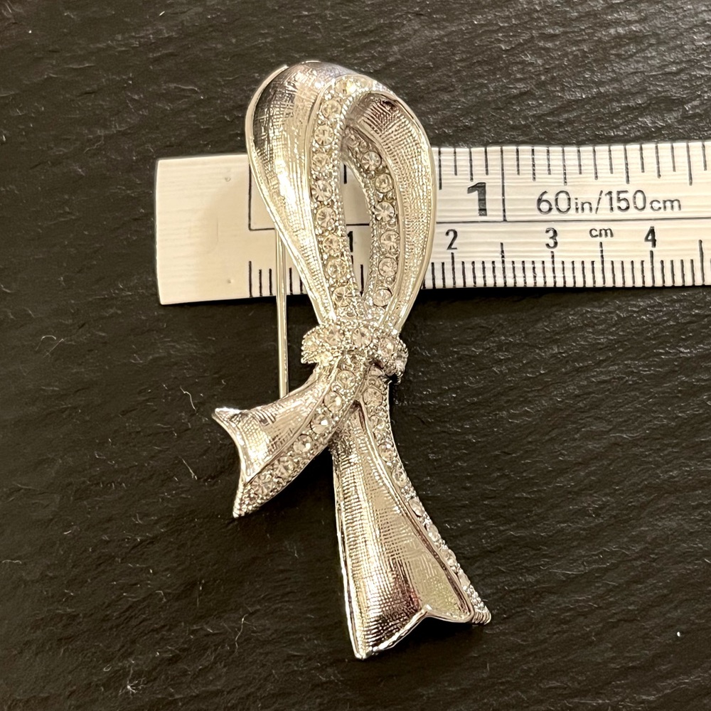 Silvertone Ribbon Rhinestone Accent Brooch - Picture 7 of 9